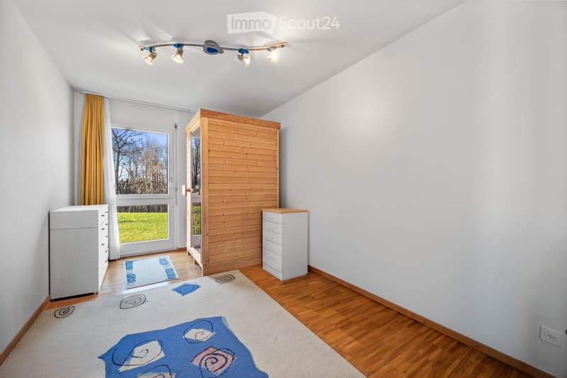 empty room, wooden floor, white walls, wooden wardrobe, white cabinets, glass door, carpet