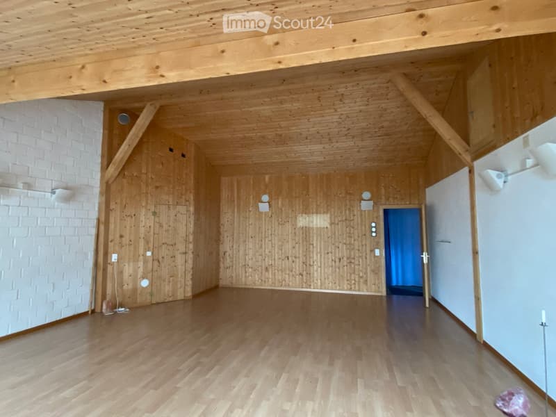empty room, wooden ceiling, wooden walls, white brick wall, wooden floor, door, blue curtain