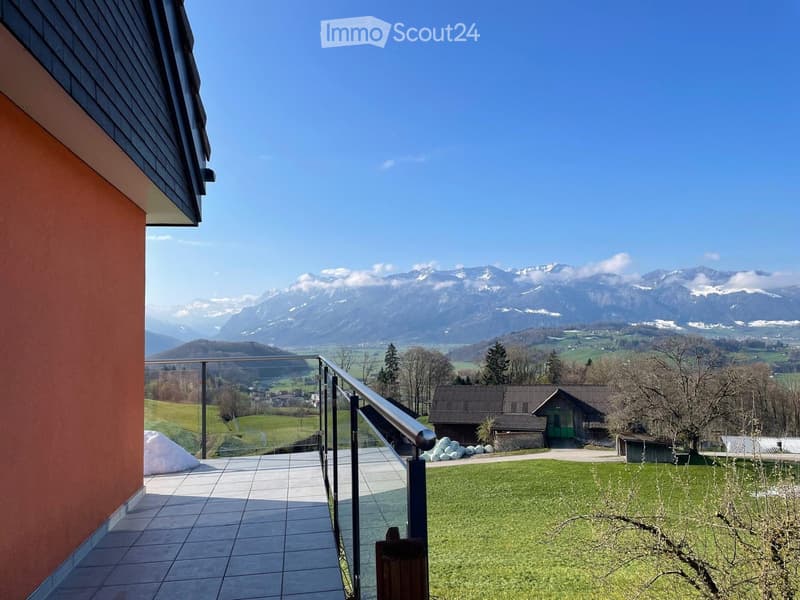 glass railing, tiled floor, view of mountains and fields