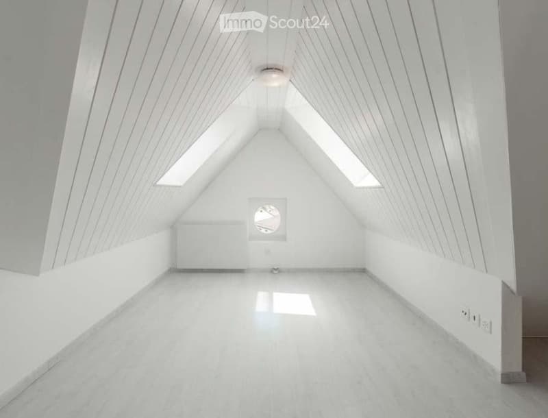 empty attic room with white walls, wooden ceiling, skylights, and white floor