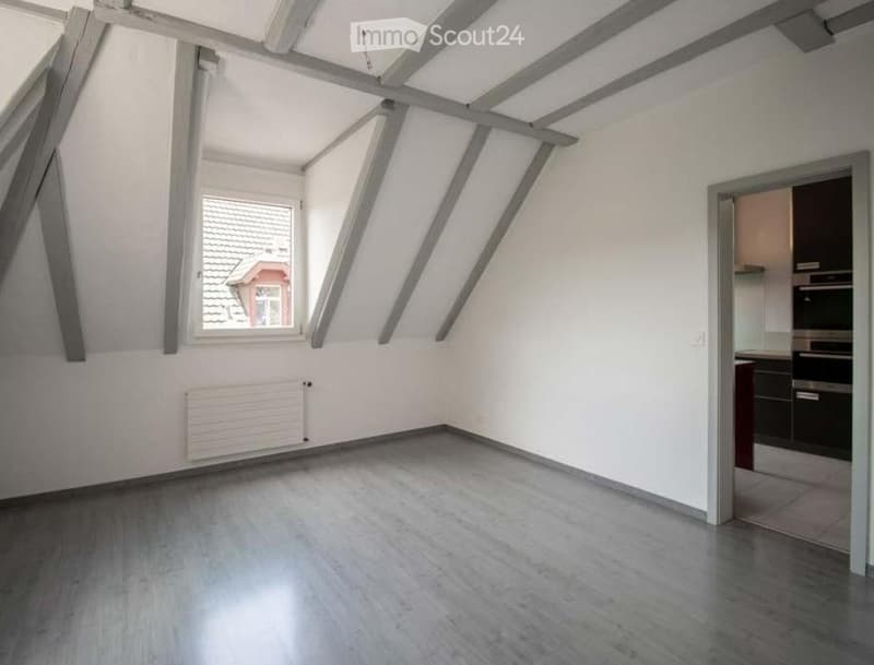 empty room, wooden floor, white walls, window, wooden beams, radiator