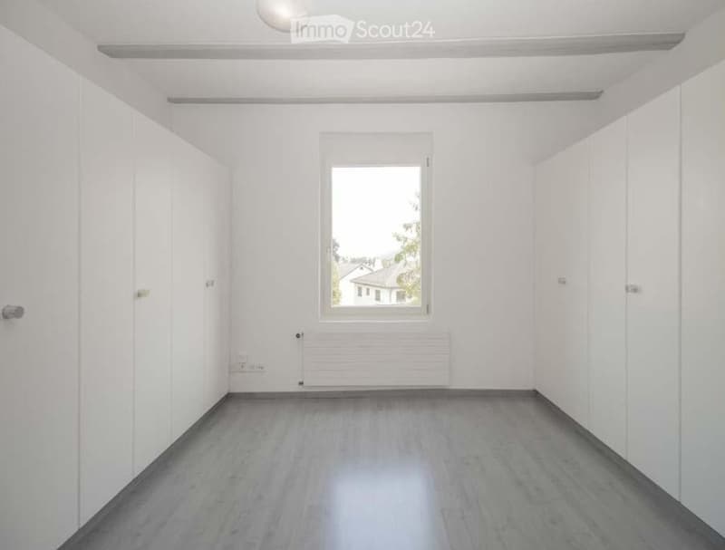 empty room, white walls, white floor, window, built-in wardrobes