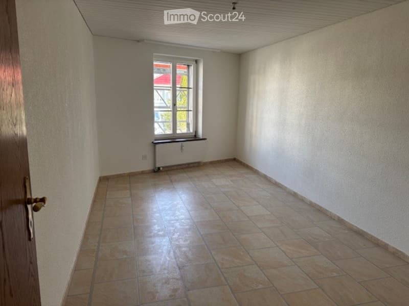 empty room, white walls, tiled floor, window, radiator