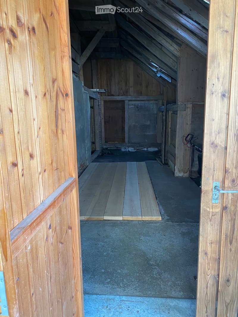 wooden walls, wooden floor, wooden beams, open door, concrete floor