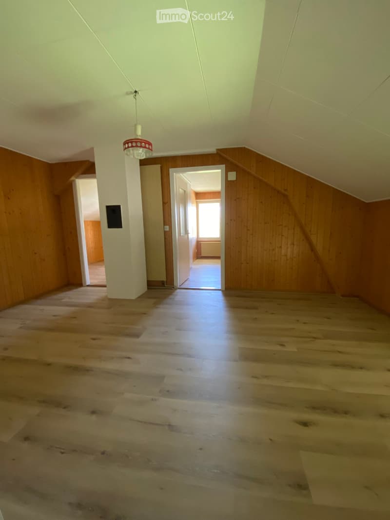 empty room, wooden walls, wooden floor, white ceiling, open door, window