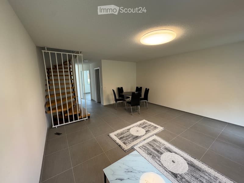 empty room, tiled floor, white walls, round ceiling light, dining table with chairs, staircase