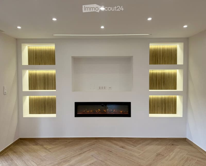 white walls, wooden floor, fireplace, recessed lighting, wall-mounted shelves
