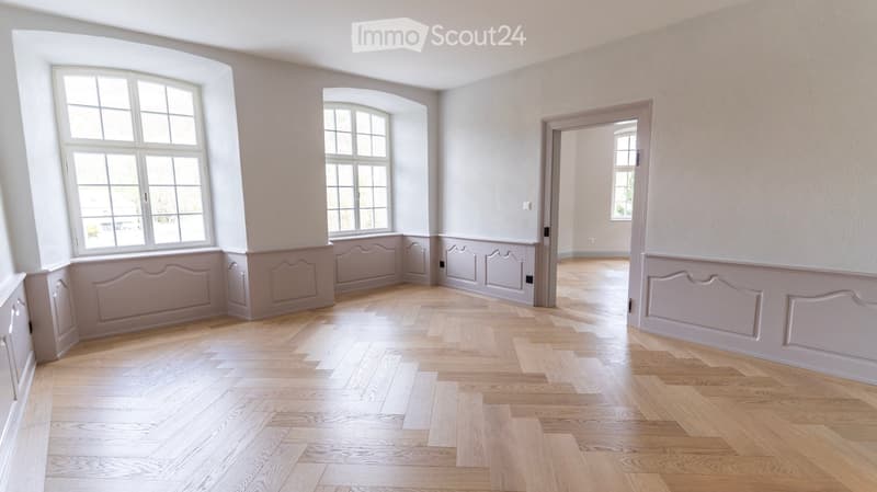 empty room, wooden parquet floor, white walls, arched windows, wooden paneling