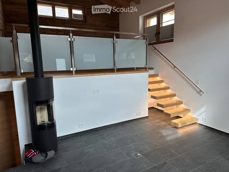 modern interior, fireplace, wooden staircase, glass railing, white walls, gray floor