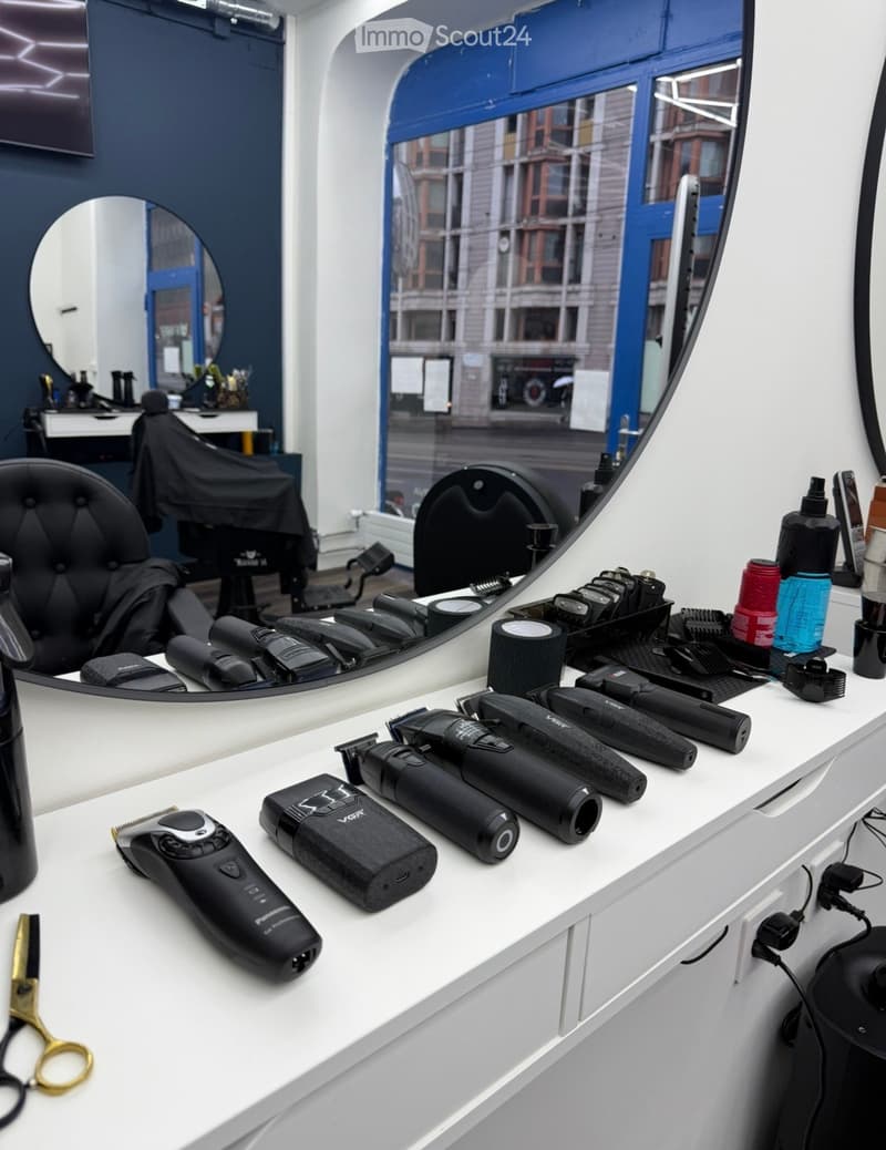 Barber shop with a counter, mirrors, chairs, and grooming tools