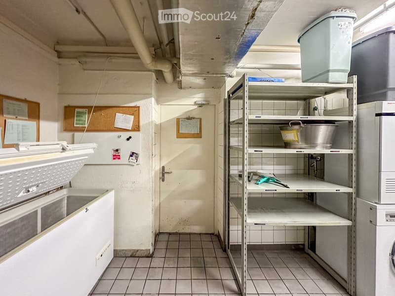 Laundry room with washing machine, dryer, and shelves