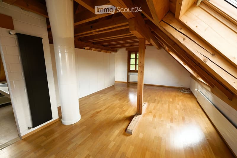wooden floor, wooden beams, white walls, radiator, window