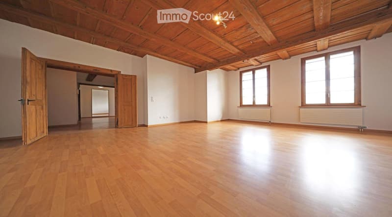 empty room, wooden floor, wooden ceiling, two windows, two doors