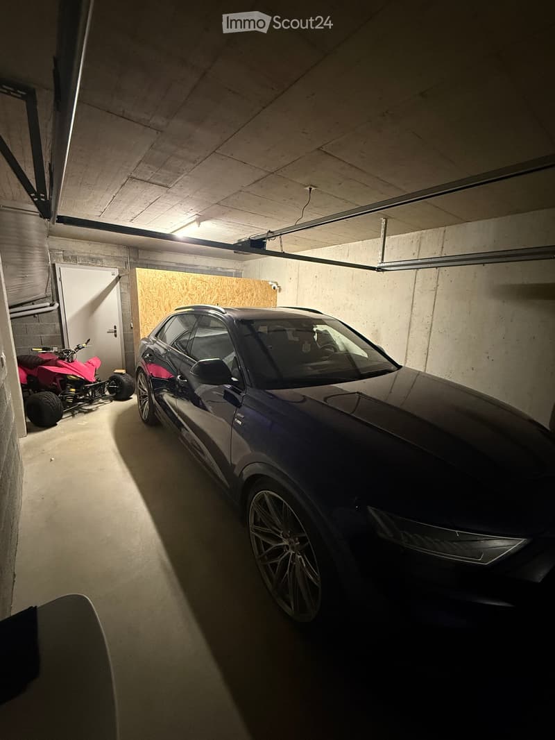underground parking space, car, quad bike, concrete walls, white door