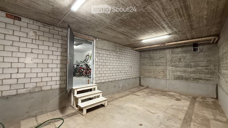 underground room, white brick walls, concrete ceiling, white steps, bicycles