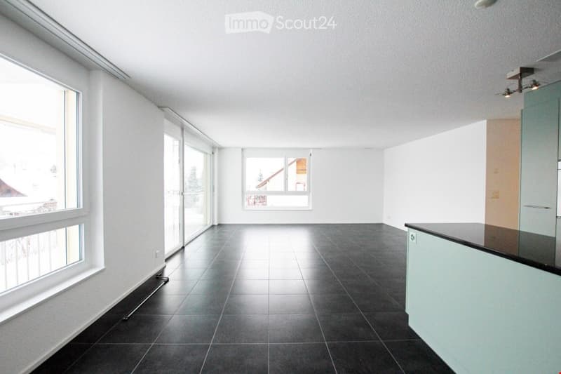 Empty room, white walls, black tiled floor, large windows, modern design