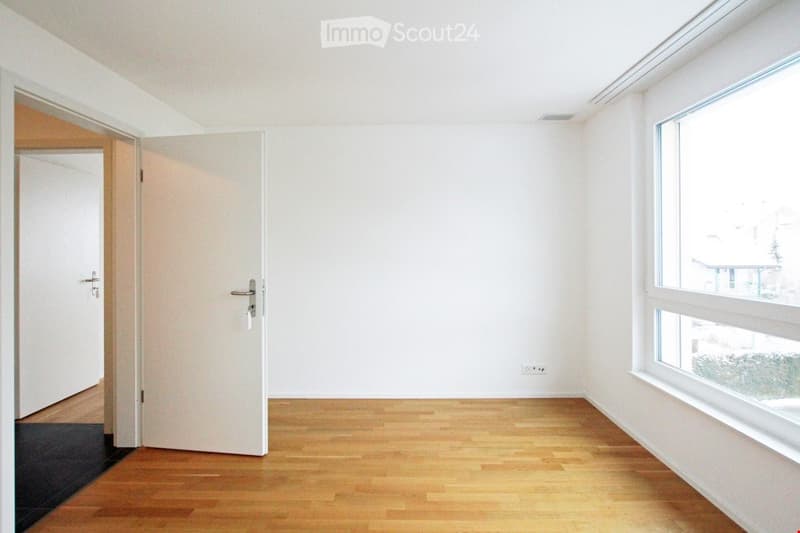 empty room, white walls, wooden floor, large window, open door