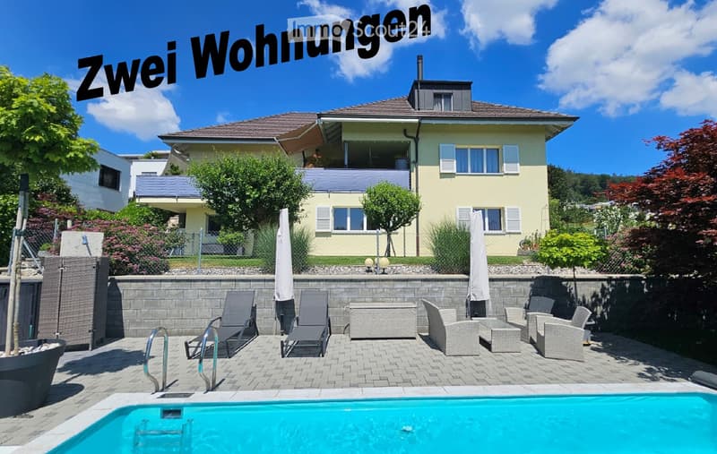 Yellow house, brick wall, blue pool, patio with lounge chairs and tables, fence, trees and plants