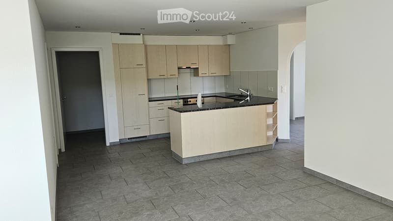 modern kitchen with island, wooden cabinets, granite countertops, stainless steel appliances, tiled floor