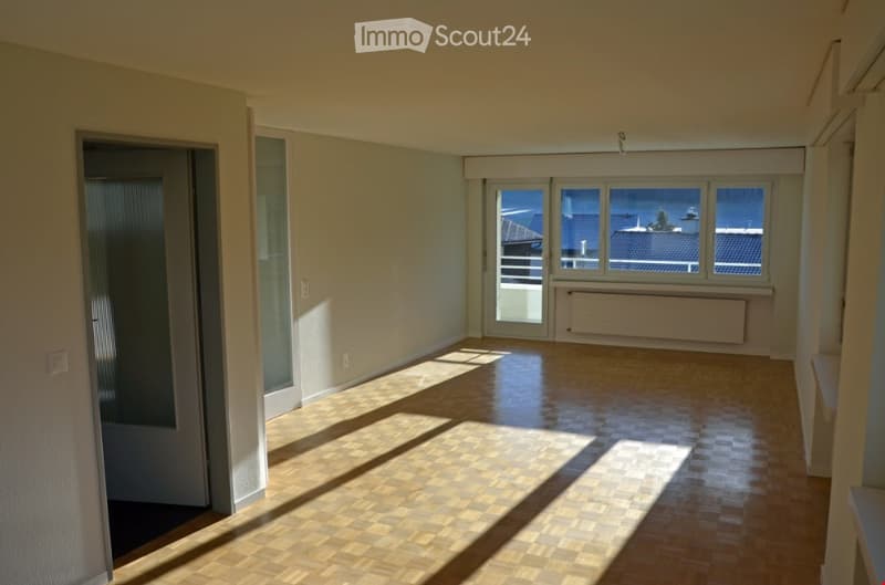 empty room, wooden floor, white walls, sliding glass doors, balcony, view of the outside