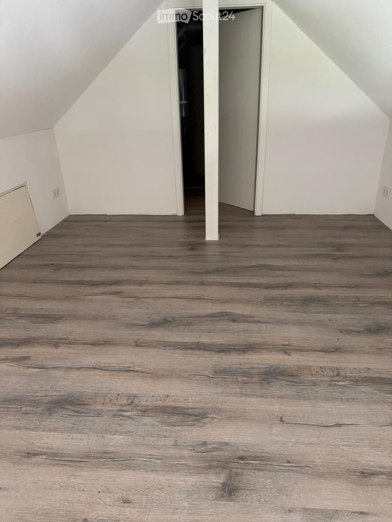 empty room, wooden floor, white walls, two doors, power outlets