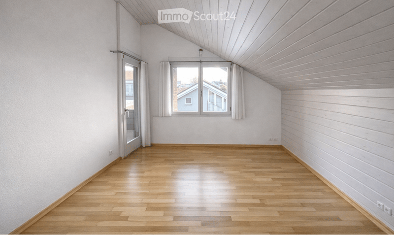 empty room, wooden floor, white walls, glass door, windows with white curtains, slanted ceiling