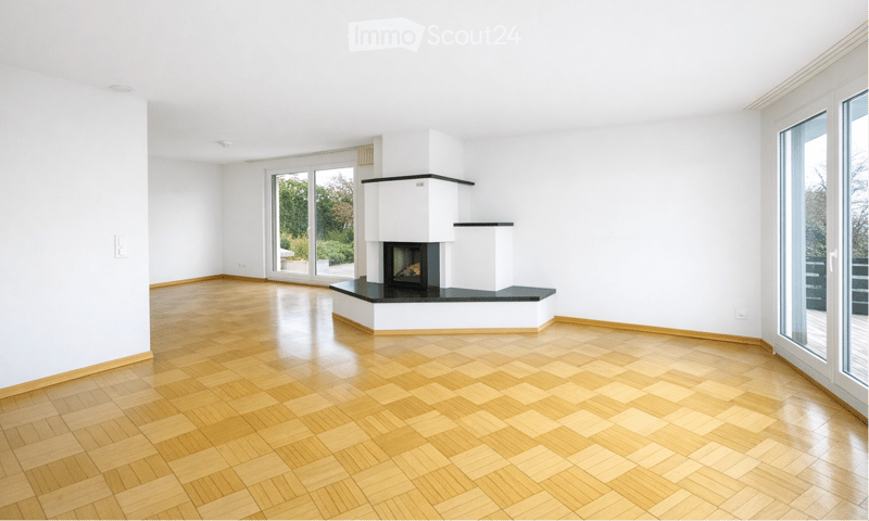 empty room, wooden floor, white walls, fireplace, sliding glass doors, balcony