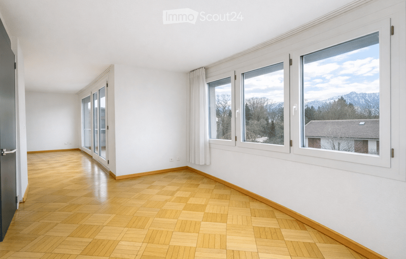 empty room, wooden floor, large windows, white walls, white curtains