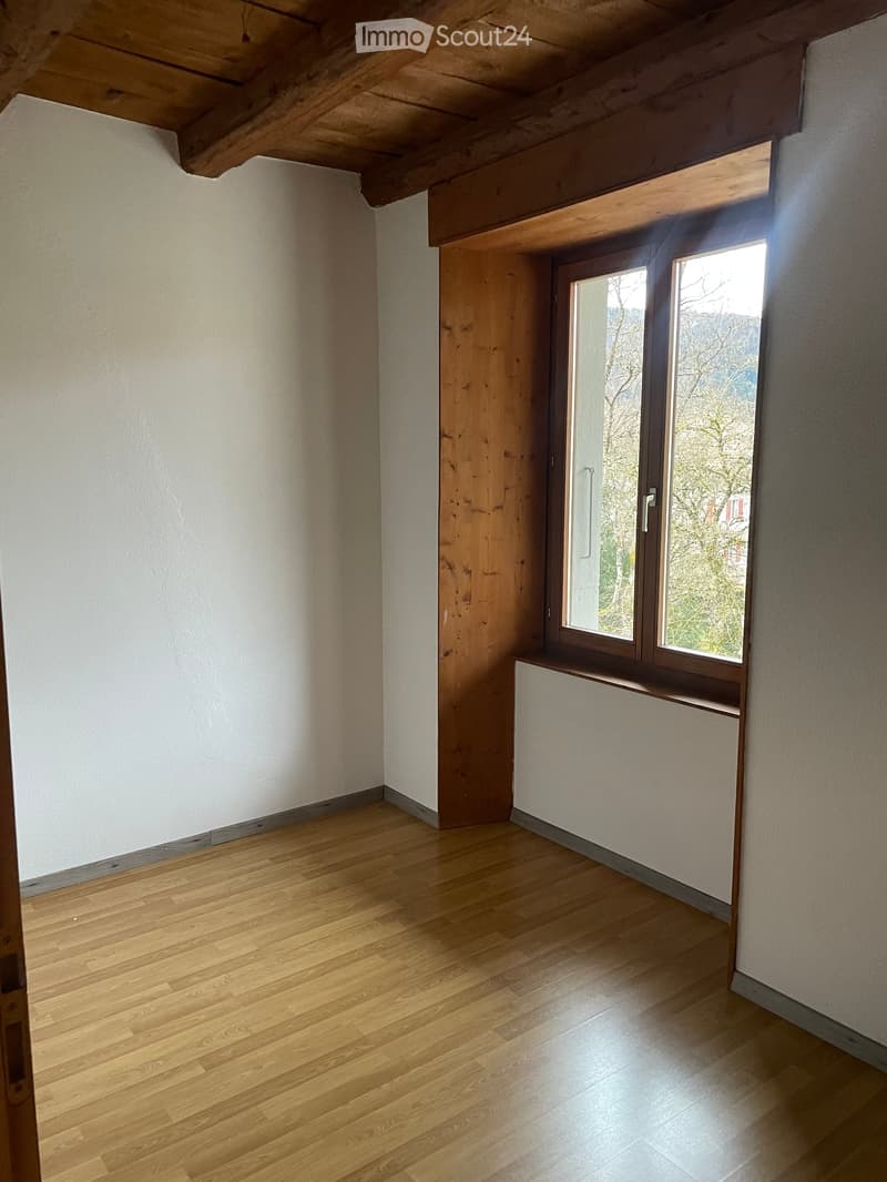 empty room, wooden ceiling, wooden floor, white walls, large window