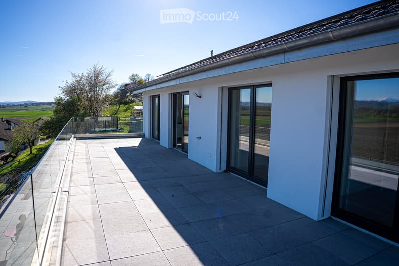 modern house, white exterior, large glass windows, balcony with glass railing, tiled floor, scenic view