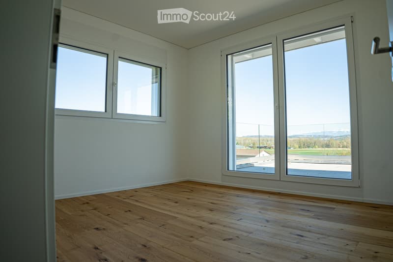 empty room, wooden floor, large windows, view of the outside