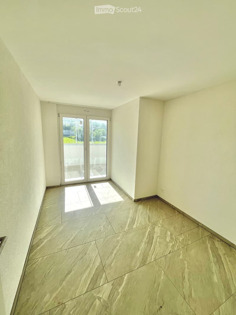 empty room, sliding glass doors, balcony, tiled floor, white walls