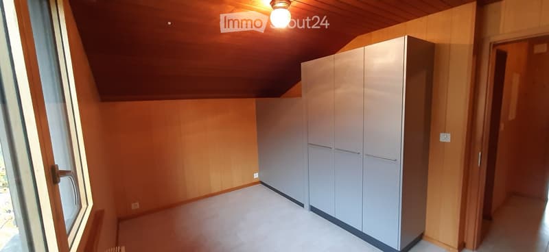 empty room, wooden walls, white floor, large wardrobe, window