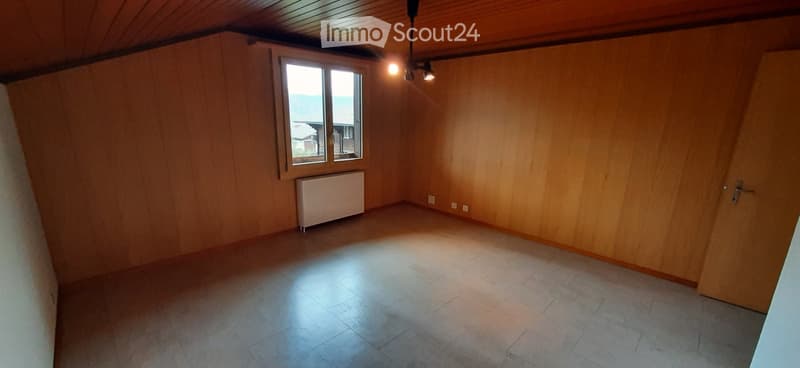 empty room, wooden walls, white floor, window, radiator