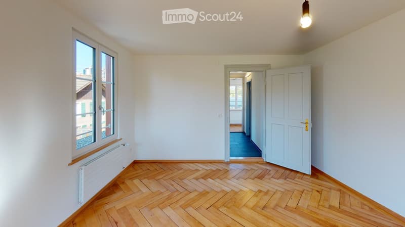 empty room, wooden floor, white walls, large window, open door