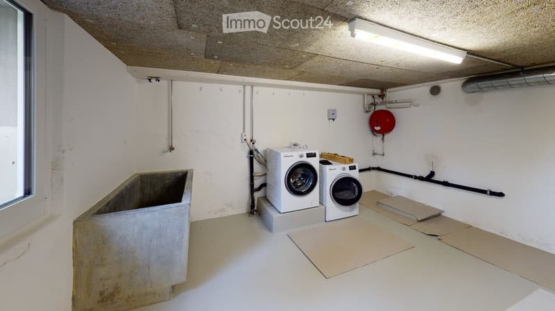Laundry room with washing machine, dryer, and sink