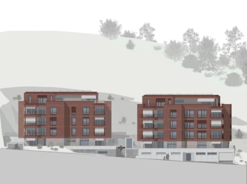 Two multi-story residential buildings with red brick facades, located on a hillside with trees in the background.