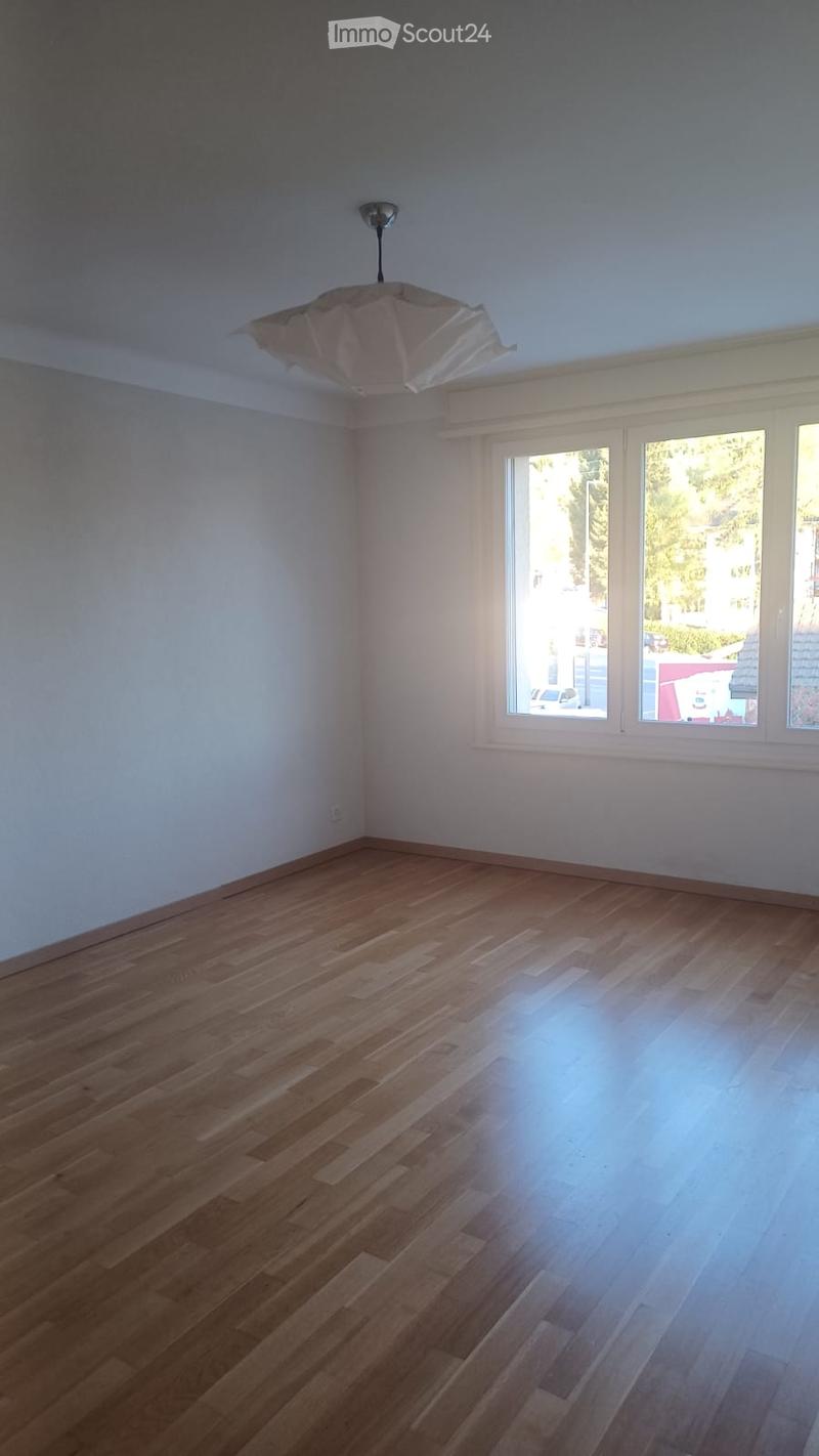 empty room, wooden floor, white walls, large windows, ceiling lamp