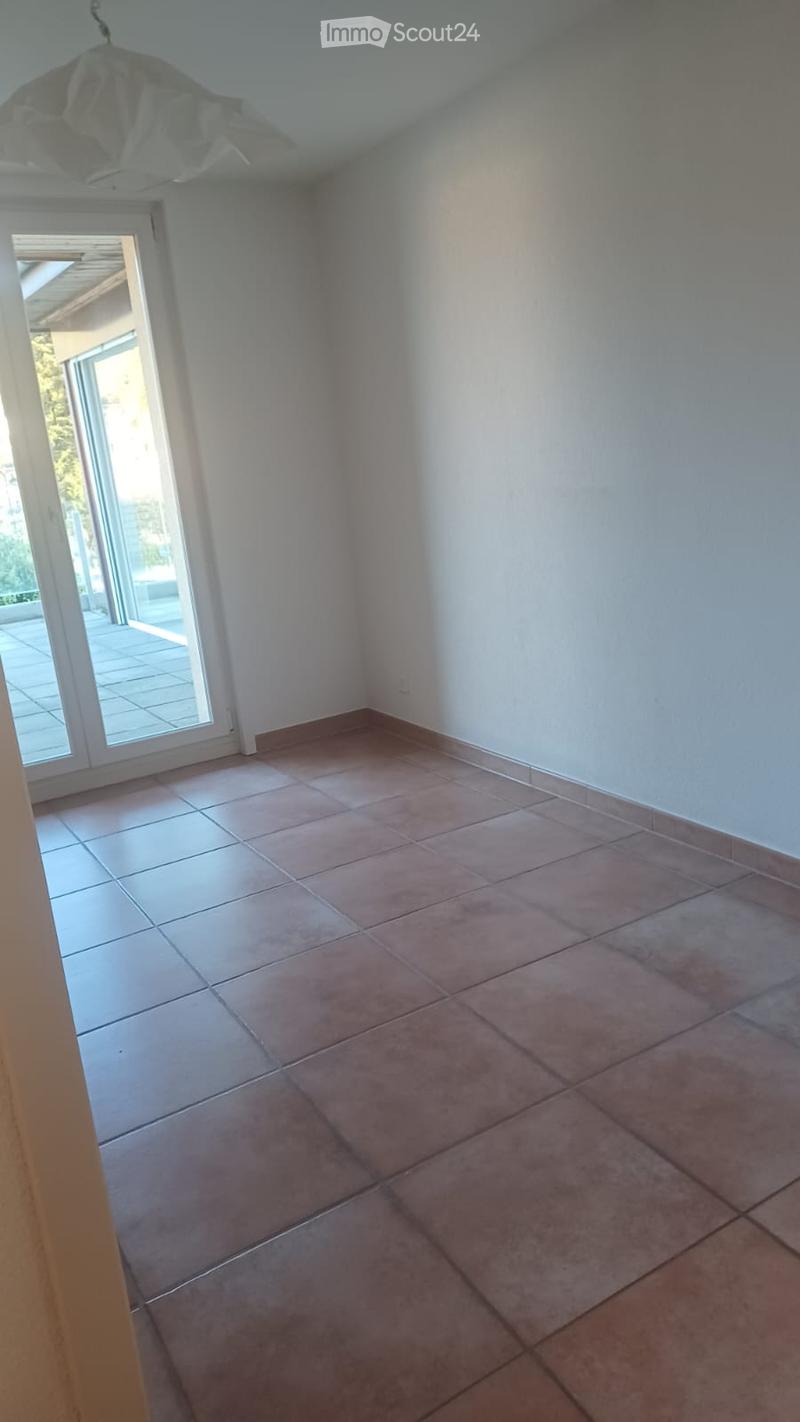 empty room, brown tiles, sliding glass door, balcony