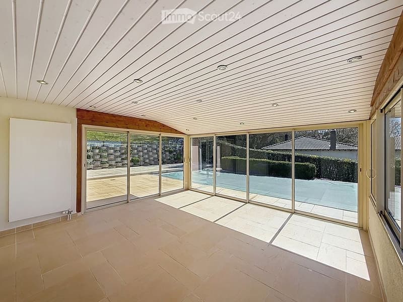 empty room with sliding glass doors, tiled floor, white ceiling, view of swimming pool