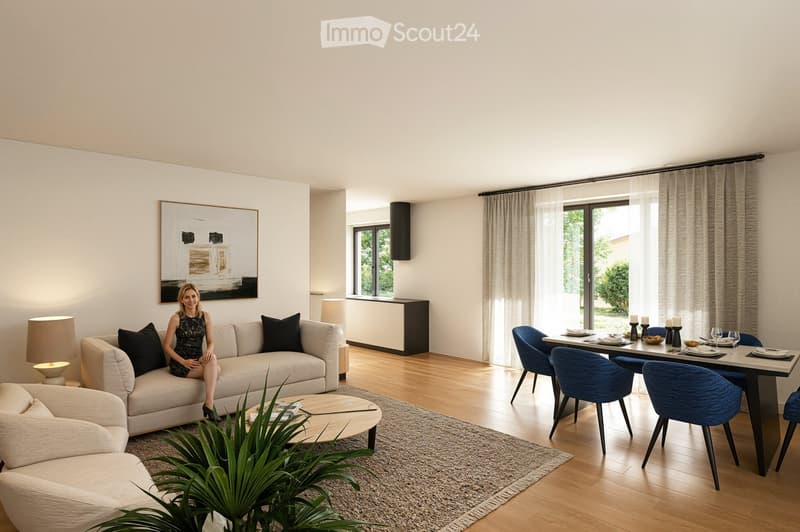Modern living room with a couch, coffee table, and a dining area with a table and chairs.