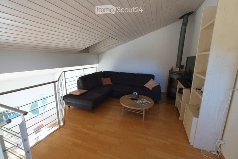 L-shaped sofa, coffee table, fireplace, wooden floor, balcony, glass window, wooden ceiling