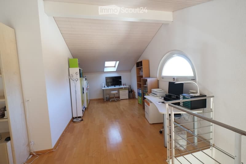 wooden floor, white walls, desk, chair, monitor, printer, shelves, lamp, window