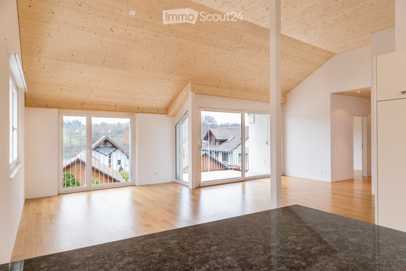 large windows, wooden floor, wooden ceiling, open to balcony