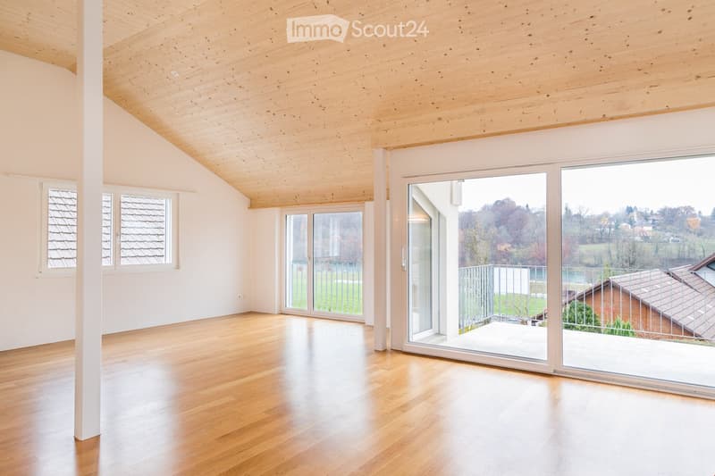 empty room, wooden floor, white walls, wooden ceiling, large windows, balcony