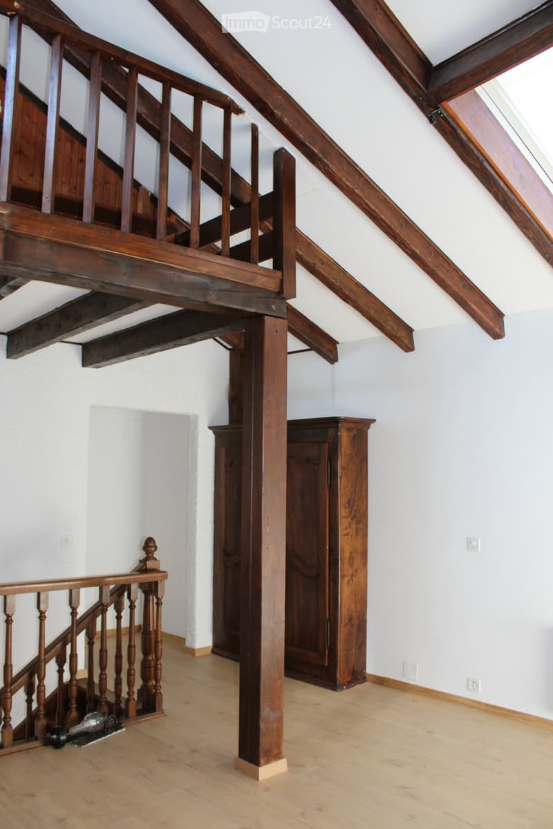 Unfurnished Room. Empty room with wooden beams, wooden floor, and a wooden cabinet against the wall.