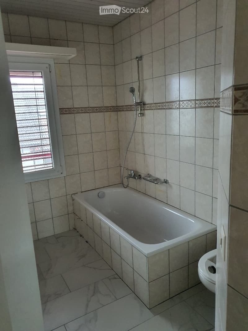 Bathroom. Bathroom with a bathtub, shower head, faucet, and toilet.