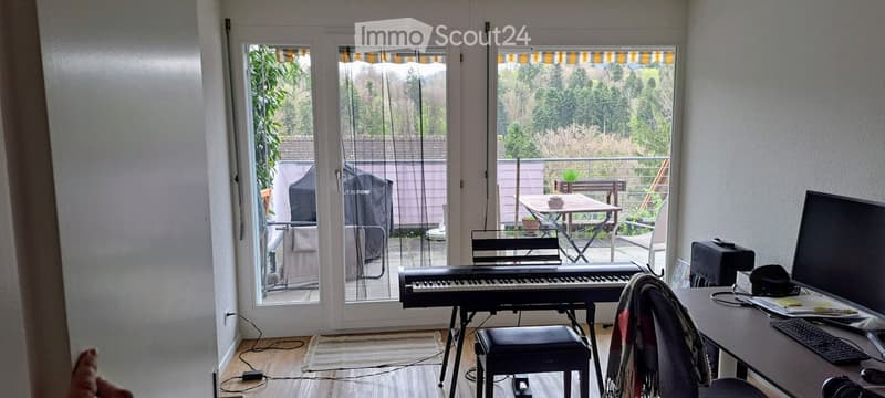sliding glass doors, balcony, piano, desk, computer, keyboard, chair, rug