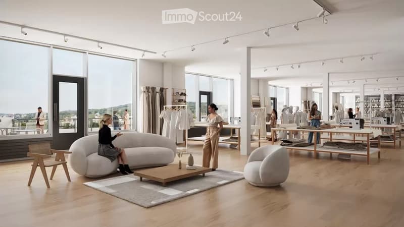 A modern furnished room with a large white sofa, a wooden coffee table, and a round white chair. A rug is placed on the wooden floor. A woman is sitting on the sofa, and a man is standing near the door. A table with a sewing machine and clothes is placed