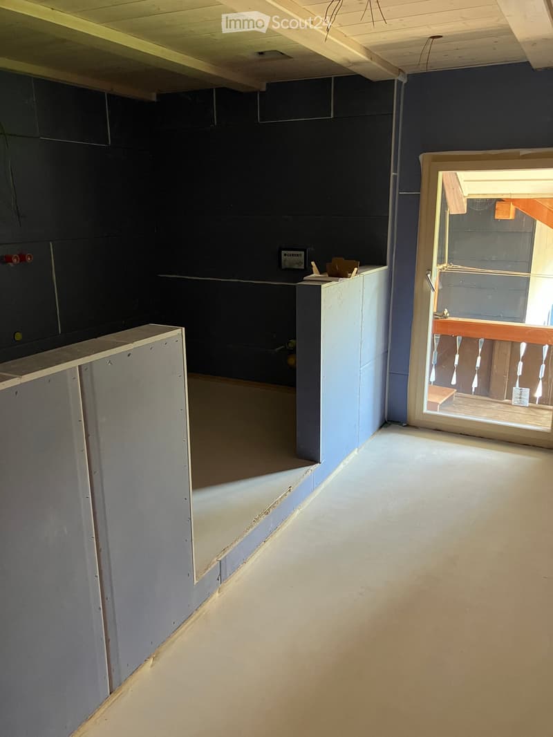 Unfurnished Room. An empty room with bare walls and floor, no furniture or equipment. The room has a wooden ceiling and a glass door leading to a balcony.